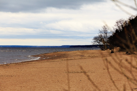 sandy beach in cloudy cold weatherの写真素材