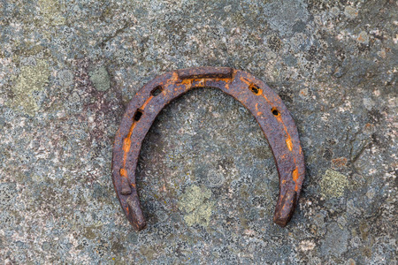 old horseshoe on stoneの写真素材