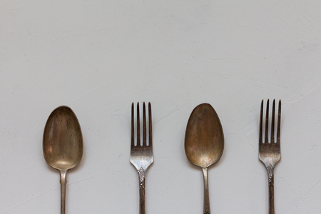 Vintage cutlery in a row. Top viewの写真素材