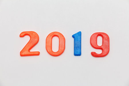 multicolored plastic numbers 2019 on a light background