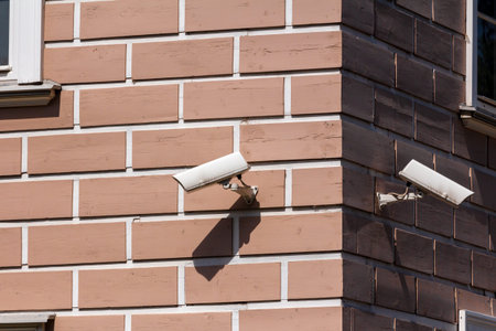 two surveillance cameras at the corner of the building. home security