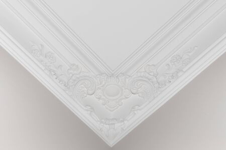 Elegant retro decorative stucco elements on the ceiling. Aesthetics of modern home decor.の写真素材