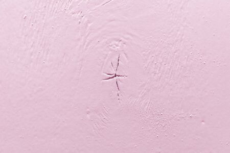 rough plywood sheet with a knot painted over with pink paint. free space for text and design. art backdropの写真素材