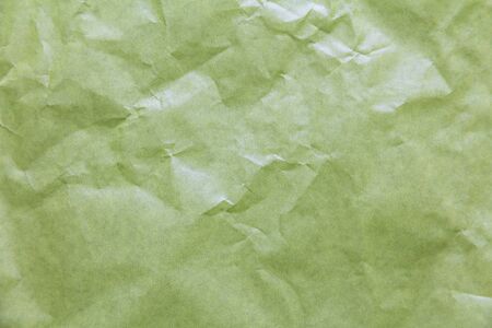 Texture of crumpled green paper. Background for text and design.の写真素材