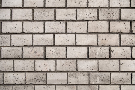 Empty gray brick wall texture for design and text. Industrial or construction background
