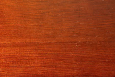 Bright brown texture of the wood surface of an aristocratic elegant old table with traces of varnish, cracks and gradientの写真素材