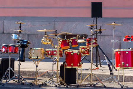 Drum set without musicians on a summer city street before a performanceの写真素材