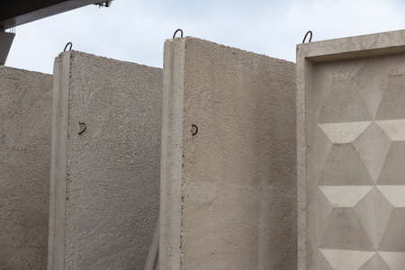 Heavy concrete slabs at the construction site prepared for installationの写真素材