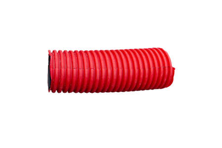 Piece of red flexible corrugated pipe isolated on white backgroundの写真素材