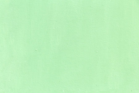 Gently green textured surface as a background for graphics and design