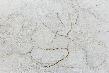 Old surface of cement plaster concrete wall with stains and cracks for background