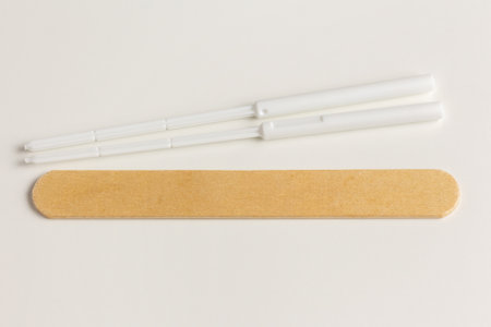 Medical disposable sterile coronavirus test sticks and wooden spatulaの写真素材