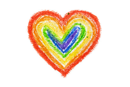 Rainbow heart drawn with crayons on a white background by a child. The concept of freedom and respect for human rightsの写真素材