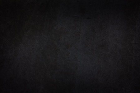 Black dark wall with vignetting and light spots. Minimalistic template for Halloween posters and bannersの写真素材