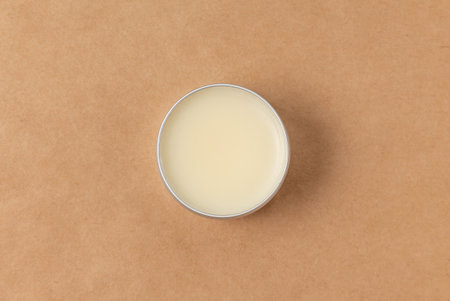 Open small tube of wax for processing genuine leather top view.の写真素材