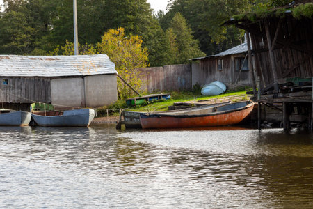 Old fishing boats at the pier of an abandoned fish factory. Fishing industryの写真素材