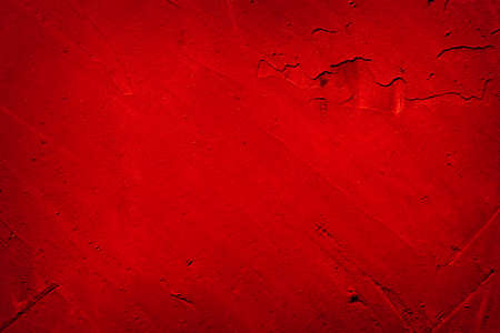 Dark red abstract grunge rough wall background with dark vignette and text spaceの写真素材