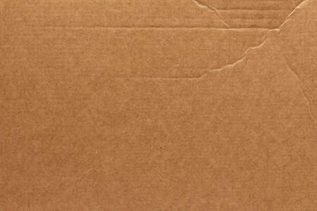 Crumpled cardboard box lid. Wrinkled brown cardboard textureの写真素材
