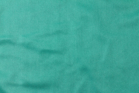 Green microfiber cloth. The texture of the cloth for wiping glass and other surfaces without dust...