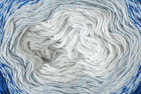 Close up blue and white thread of yarn as abstract background. Knitting yarn for handmadeの写真素材