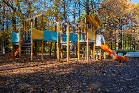 Empty playground in the park in autumn on a sunny day