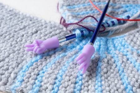 Knitting needles with plastic safety caps. Knitting processの写真素材