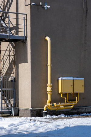 Pipes gas distribution point on the wall of the building under the supervision of a video camera. Accounting for energy consumptionの写真素材