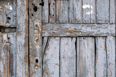 Old wooden door with cracked paint. wood textureの写真素材