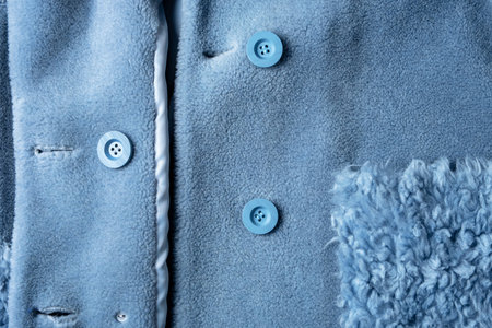 Women's elegant blue sheep's wool fur coat with buttons and a patch pocket. Warm winter comfortable clothes made of natural furの写真素材