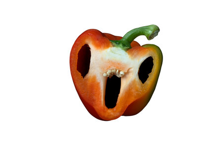 Creepy Halloween pepper face with big eyes and mouth on a white background. Holiday Red Pepper Troll Craftの写真素材