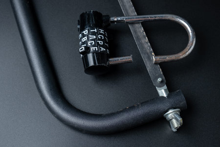 Broken combination padlock with the shackle sawed off with a hacksawの写真素材