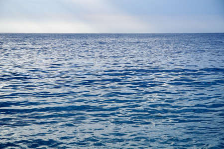 Blue sea with waves and blue skyの写真素材