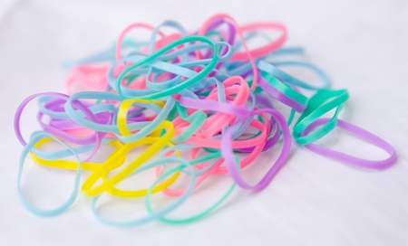 the colorful rubber band on white backgroundの写真素材