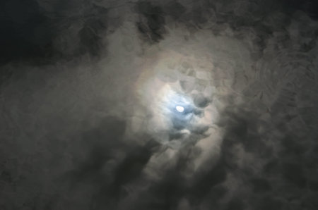 Reflection of the moon on black river, cloudy day.