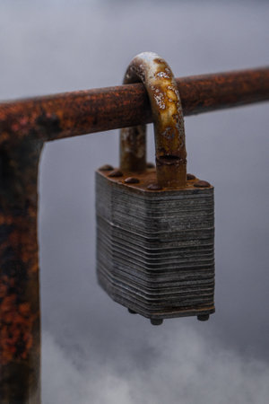 Padlock rusty on a background of fogの写真素材