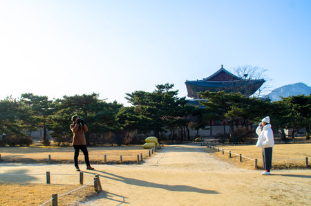 Boy taking a photo for his girlfriendのeditorial素材