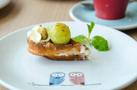 Waffle dessert with grapes toppings