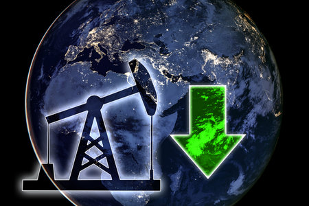 Signs oil pump and green down arrow on the background of the globe. Decline in oil prices under the influence of market conditions.の写真素材