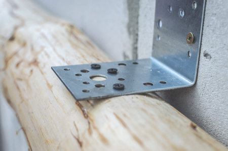 Close up on attaching wooden beam to eps blocks. The reason for anchoring your roof is to prevent...
