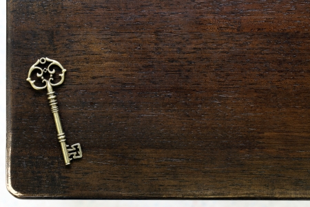 Antique key on wooden tableの写真素材