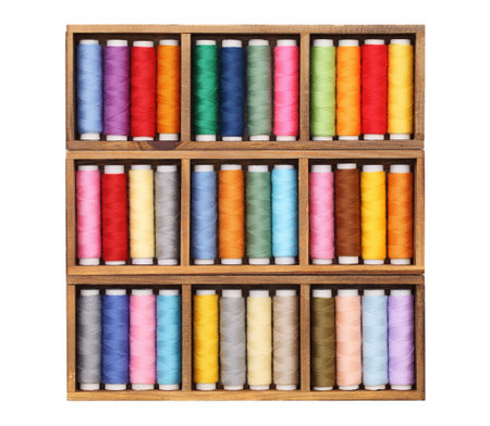 Colorful threads in wooden box 