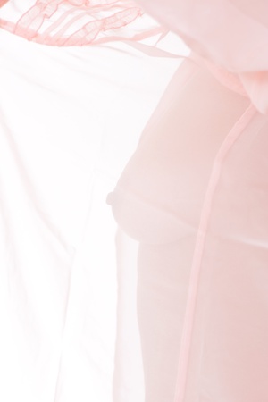 Body of a naked woman through the transparent fabricの写真素材