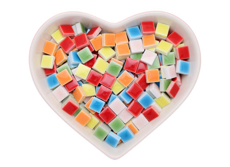 Closeup of colorful tiles in heart shape plate