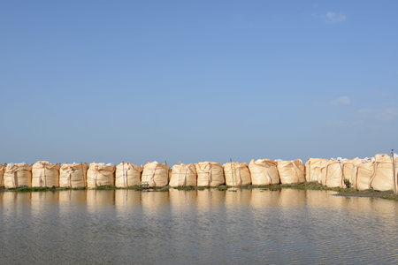 big sandbags for protection against a blue sky 