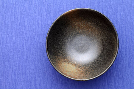 japanese rice bowl on japanese blue paper background の写真素材