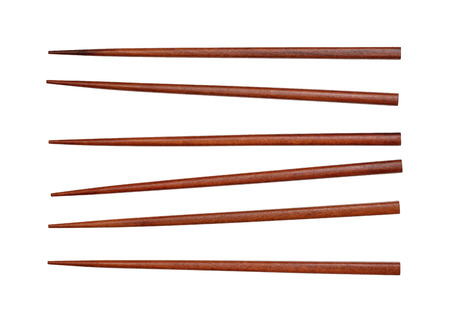 brown wooden chopsticks isolated on white backgroundの写真素材