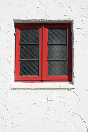 Vintage red window on the white wallのeditorial素材