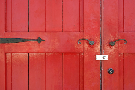 Part of old wooden red door with metal handleのeditorial素材