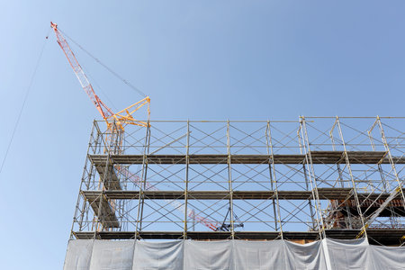 New building construction against a blue sky