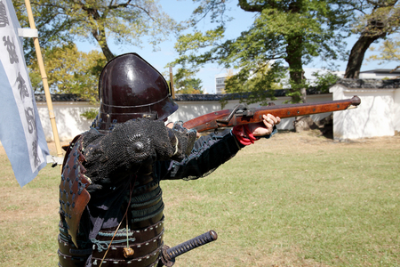 KAGAWA, JAPAN-OCTOBER 25: Ancient firelock rifle fighters at Marugame Historical battle Festival, event dedicated to Japanese culture and tradition at Marugame-castle on October 25, 2015 in Japan.のeditorial素材